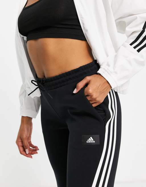 Pantalones campana negros con rayas de adidas Sportswear |