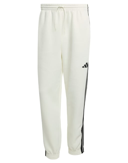 Pantalones de chándal blanco hueso y negros Stadium de adidas Performance, 5 de 5