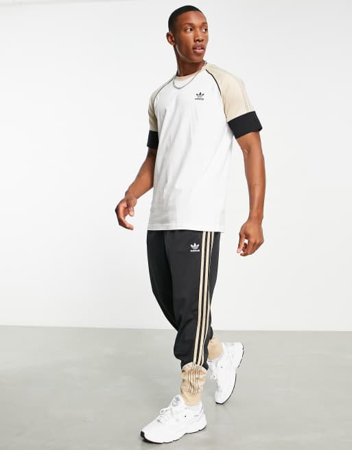 Pantalones de ch ndal color arena y negros SPRT US de adidas