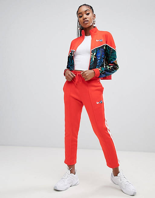 bordado sugerir Formación Pantalones de chándal con estampado tropical rojo Hyper Femme de Nike | ASOS