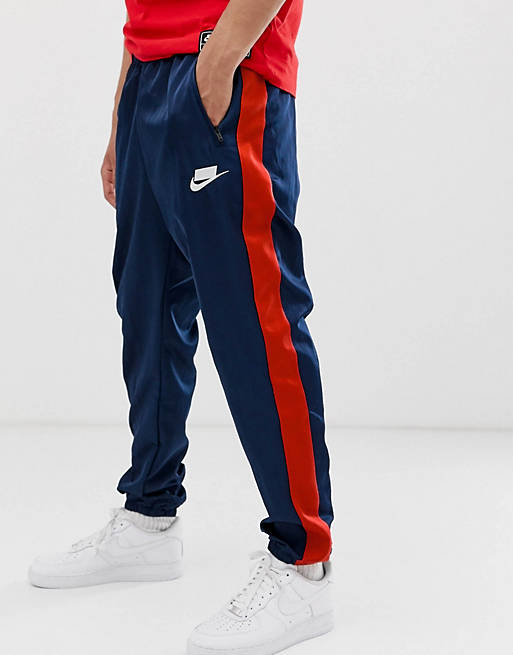 Gracias por tu ayuda Prueba famoso Pantalones de chándal con logo y raya lateral en azul marino de Nike | ASOS