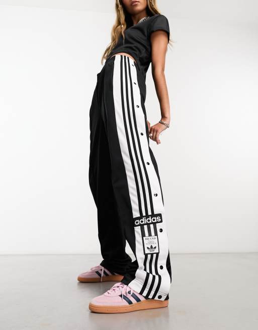 Pantalones de ch ndal negros con botones de presi n en los laterales Adibreak de adidas Originals