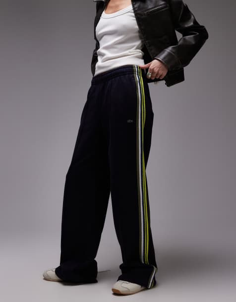 Pantalones de chándal negros con cremallera y detalle a rayas de Lacoste - view 1