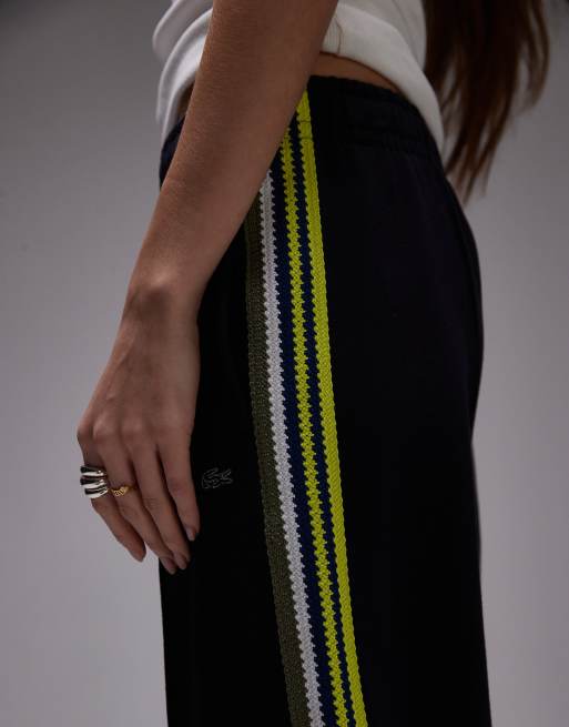 Pantalones de chándal negros con cremallera y detalle a rayas de Lacoste , 2 de 5