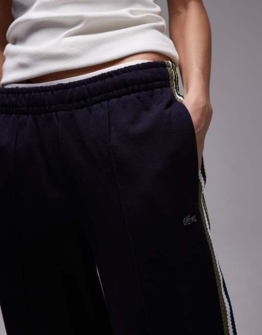 Pantalones de chándal negros con cremallera y detalle a rayas de Lacoste , 4 de 5