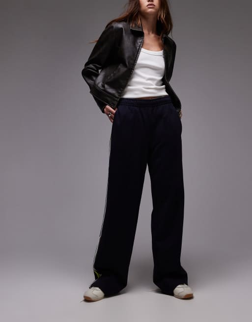 Pantalones de chándal negros con cremallera y detalle a rayas de Lacoste , 5 de 5