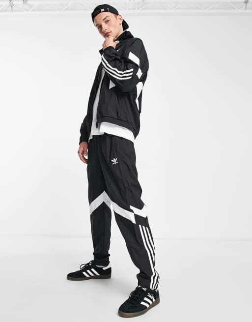 Pantalones de ch ndal negros con logo y 3 rayas Rekive de adidas