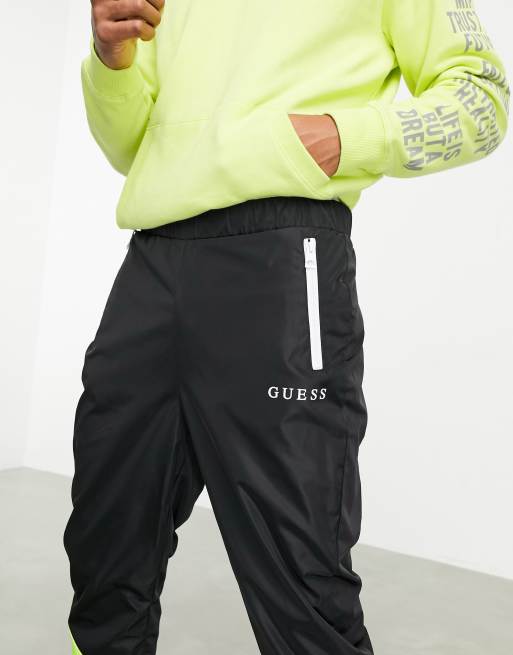 Pantalones de chándal negros con paneles de neón de nylon de Guess