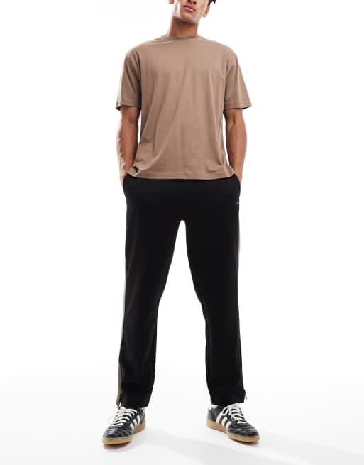 Pantalones de chándal negros holgados con logo Dolos de HUGO RED, 2 de 5