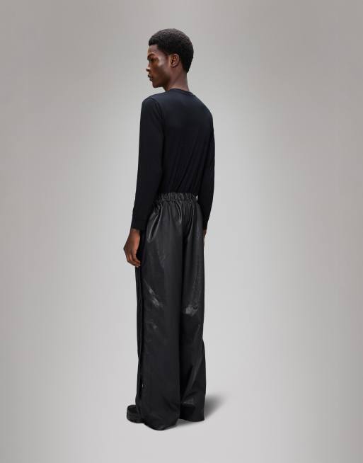 Pantalones de chándal negros holgados impermeables con cremallera