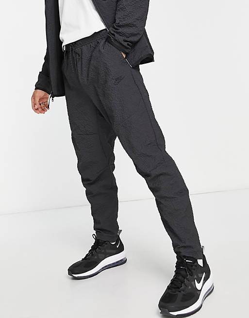Pantalones de chándal negros técnicos felpa texturizada de Nike | ASOS