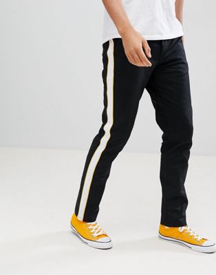 conversacion vela aburrido Pantalones de corte slim en negro con raya lateral en blanco y amarillo de  ASOS DESIGN | ASOS