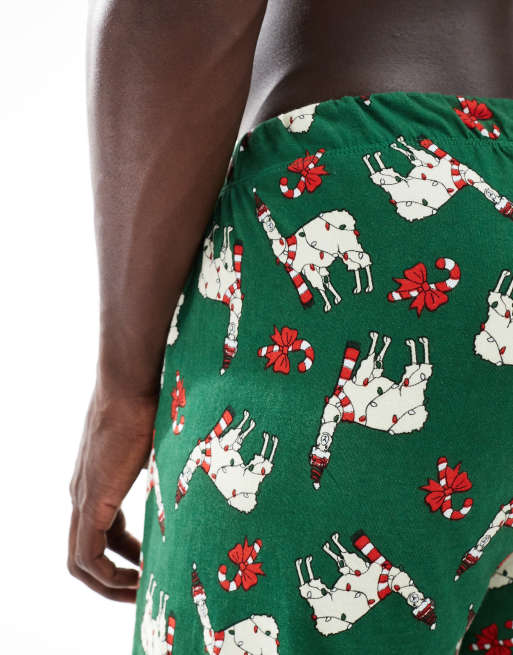 Pantalones de estar por casa verde oscuro para Navidad con estampado de llamas de ASOS DESIGN, 3 de 4