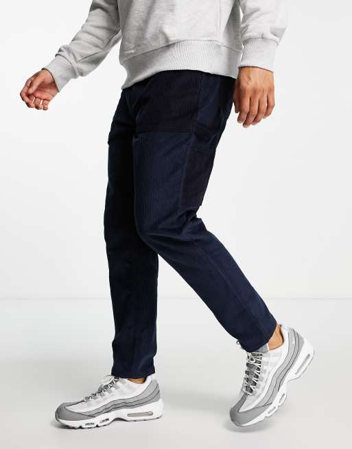 Pantalones de estilo carpintero de corte tapered con bolsillos de pana de ASOS DESIGN
