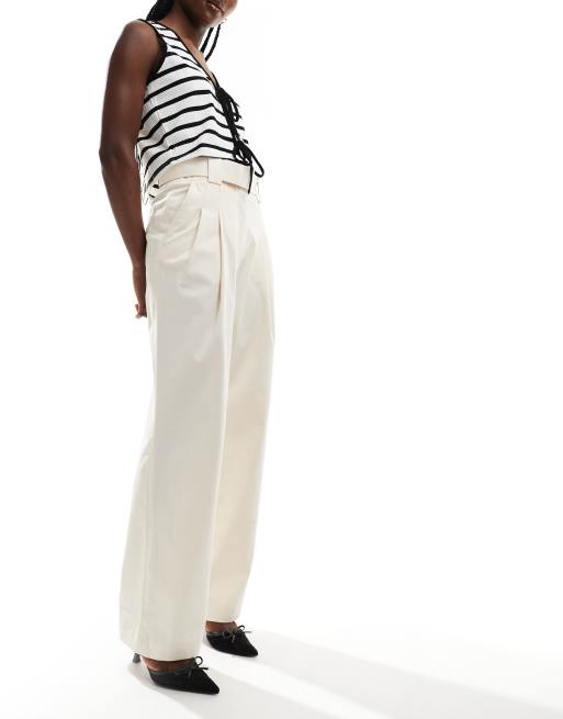 Pantalones de sastre beis con cinturón de Mango