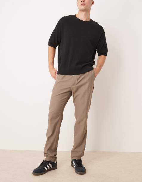 Pantalones de sastre marrones de corte tapered con detalle de pliegue de Mango - view 1