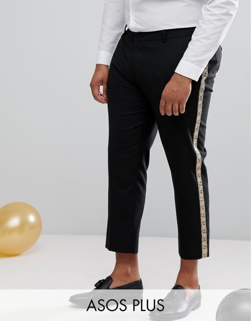 Pantalones de traje ajustados en negro con raya lateral de brocado