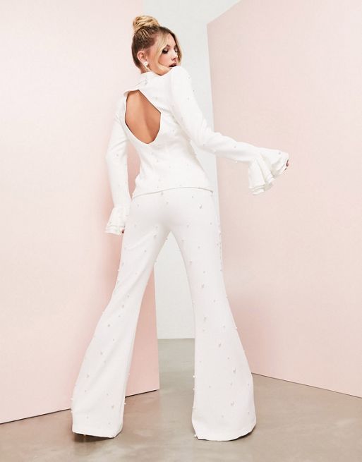 Pantalones blancos de campana de encaje transparente de ASOS Luxe