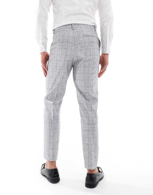 Pantalones de traje gris claro de corte tapered de tejido texturizado con algodón de ASOS DESIGN, 4 de 5