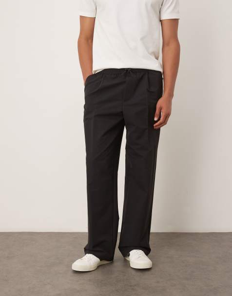 Pantalones de traje negros de corte ancho de estilo casual de tejido técnico de ASOS DESIGN - view 1