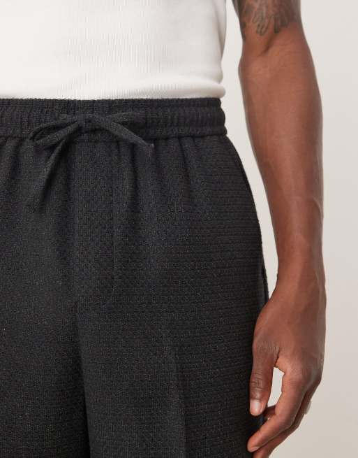 Pantalones de traje negros de pernera ancha de tejido texturizado de ASOS DESIGN, 3 de 5