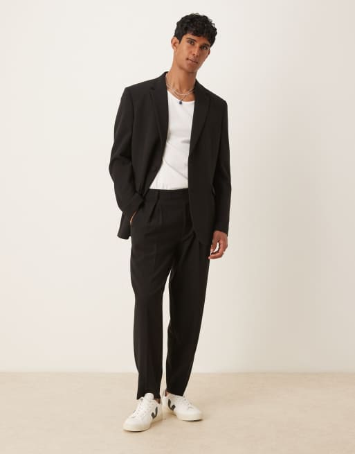 Pantalones de traje negros extragrandes de corte tapered de ASOS DESIGN, 4 de 5