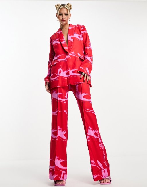 Pantalones de traje rojos y rosas con estampado marmoleado de House of Holland