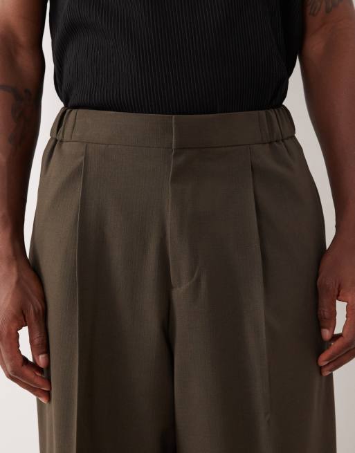 Pantalones de traje verde oliva de corte abombado con cinturilla elástica de ASOS DESIGN, 4 de 5