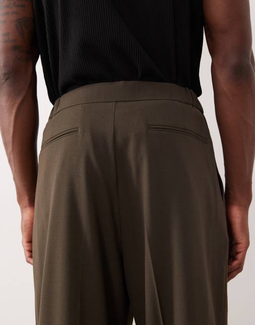 Pantalones de traje verde oliva de corte abombado con cinturilla elástica de ASOS DESIGN, 5 de 5