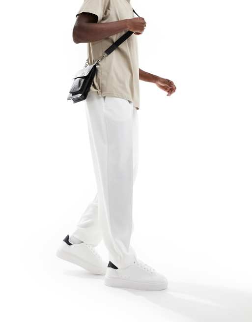 Pantalones de vestir blancos de corte tapered extragrande de ASOS DESIGN