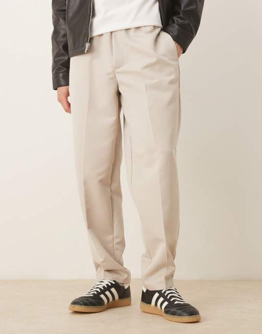 Pantalones de vestir color piedra de corte tapered con cinturilla elástica de ASOS DESIGN