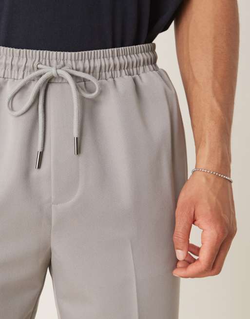 Pantalones de vestir grises de corte tapered sin cierres de ASOS DESIGN, 5 de 5