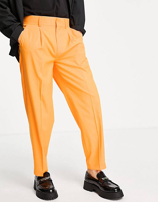 Hombre Other | Pantalones de vestir naranjas de corte tapered extragrande de ASOS DESIGN - OX75278