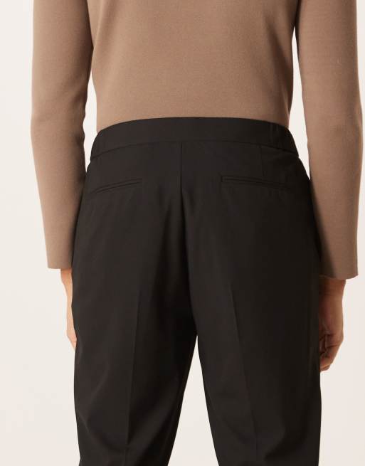 Pantalones de vestir negros cómodos elásticos de corte tapered con cinturilla elástica de ASOS DESIGN, 4 de 5