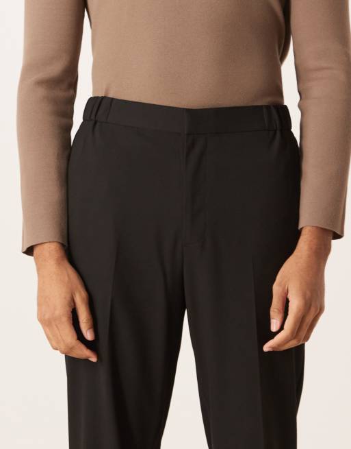 Pantalones de vestir negros cómodos elásticos de corte tapered con cinturilla elástica de ASOS DESIGN, 5 de 5