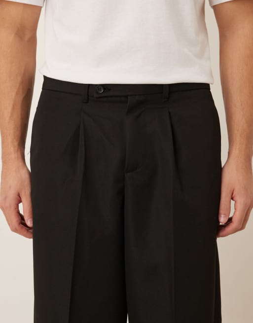 Pantalones de vestir negros de corte carrot con cinturilla con dos botones de ASOS DESIGN, 4 de 5