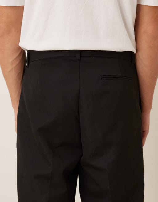 Pantalones de vestir negros de corte carrot con cinturilla con dos botones de ASOS DESIGN, 5 de 5