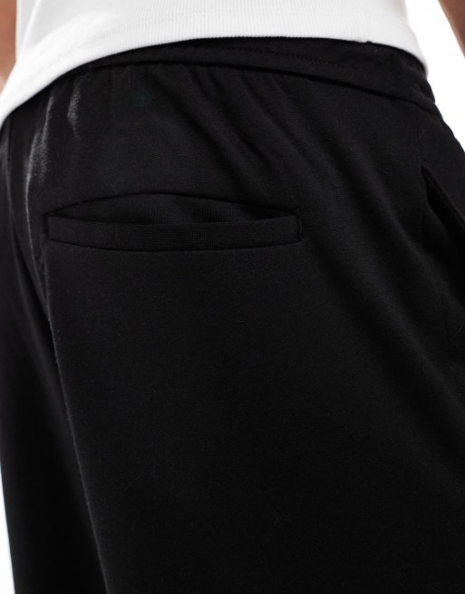 Pantalones de vestir negros de corte tapered con cordón ajustable de Jack & Jones , 5 de 5