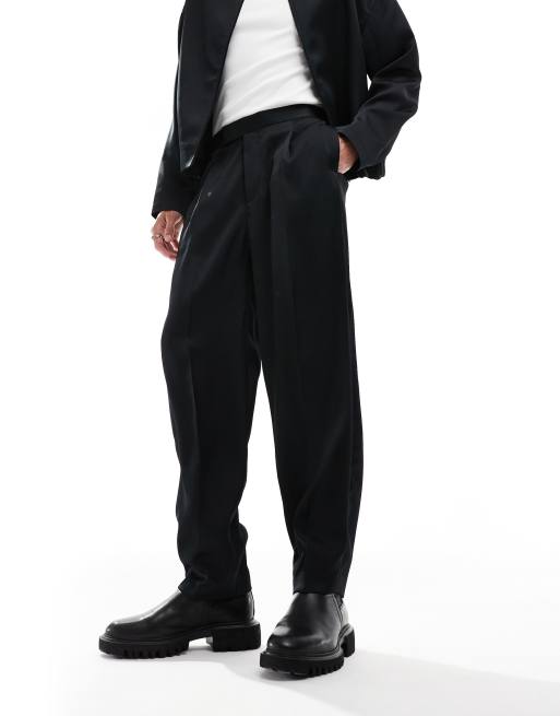 Pantalones de vestir negros de corte tapered extragrande con cinturilla elástica de ASOS DESIGN (parte de un conjunto), 2 de 4