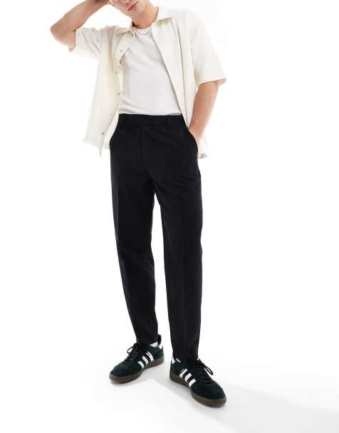 Pantalones de vestir negros de corte tapered extragrande de ASOS DESIGN - view 1