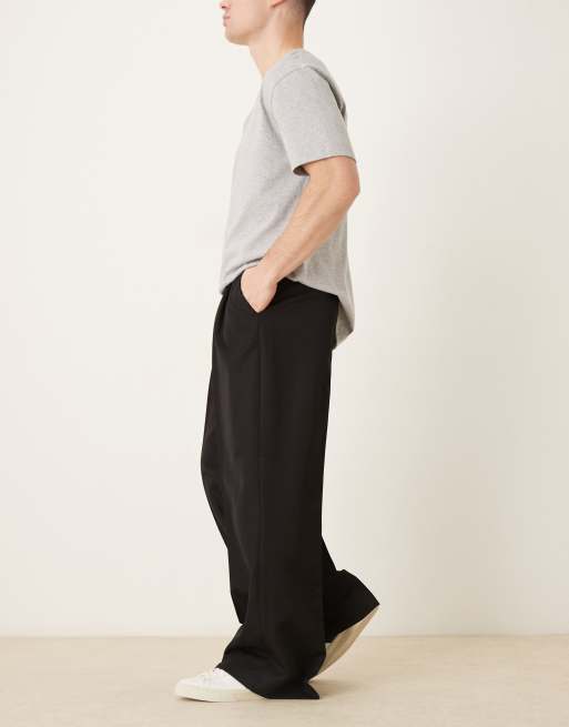 Pantalones de vestir negros de pernera suelta con pinzas de ASOS DESIGN, 3 de 5