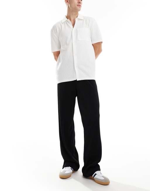 Pantalones de vestir negros plisados de pernera ancha de ASOS DESIGN