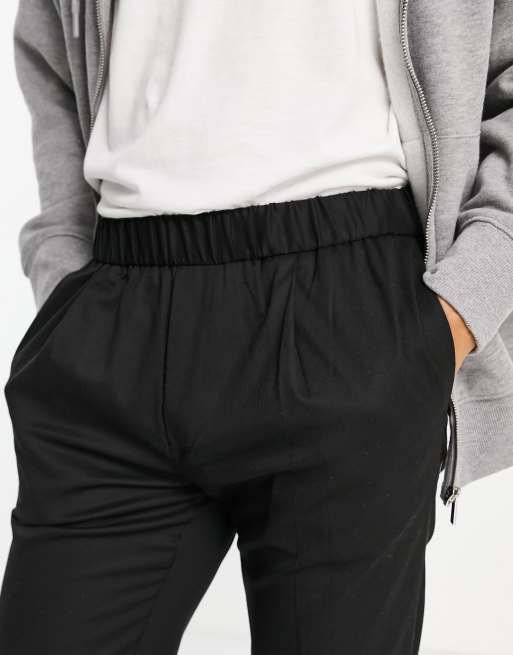 Pantalones de vestir negros tapered con bajos vueltos de Topman, 3 de 4