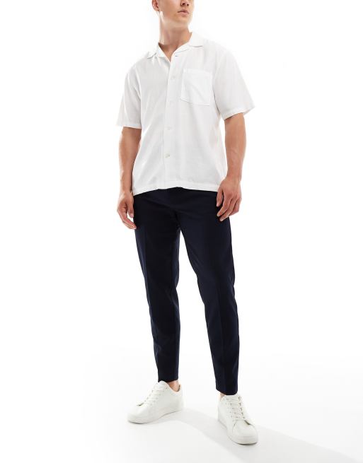 Pantalones de vestir tapered en azul marino de ASOS DESIGN