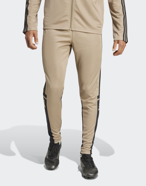 Pantalones deportivos arena cargo, negros y vainilla cálido Squadra 25 de adidas Performance