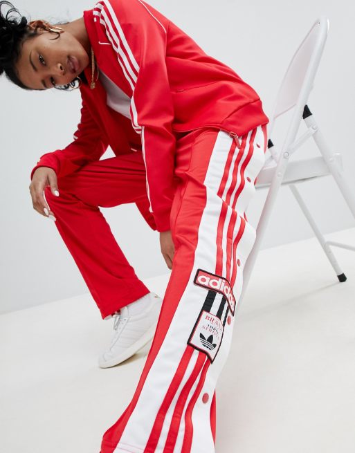 Pantalones en rojo con botones de presión adicolor Adibreak de adidas  Originals