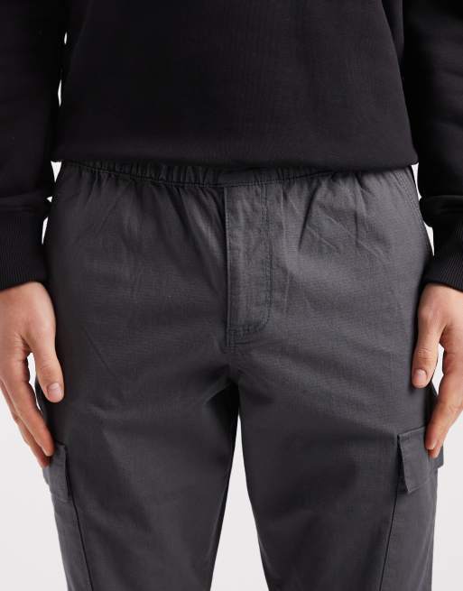 Pantalones gris carbón cargo de corte slim sin cierres de tejido antidesgarros de ASOS DESIGN, 5 de 5