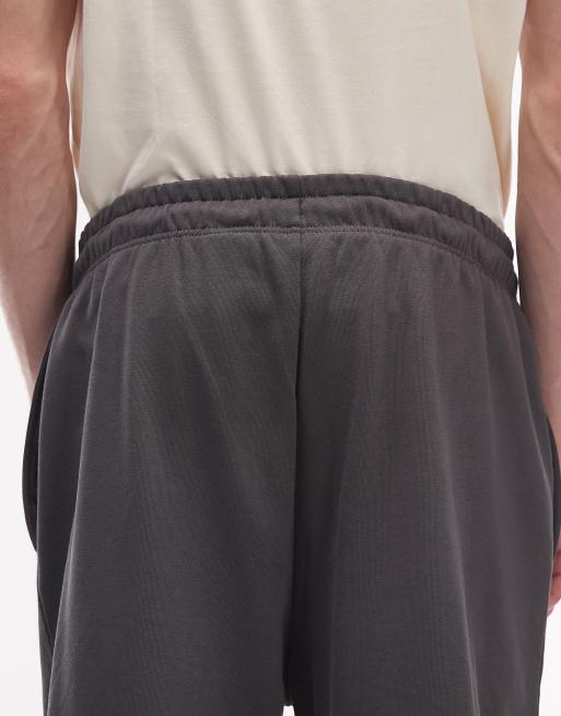 Pantalones gris oscuro básicos ligeramente extragrandes con logo de The North Face, 5 de 5