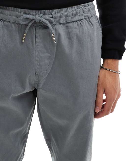 Pantalones grises de corte tapered sin cierres con cinturilla elástica de ASOS DESIGN , 5 de 5