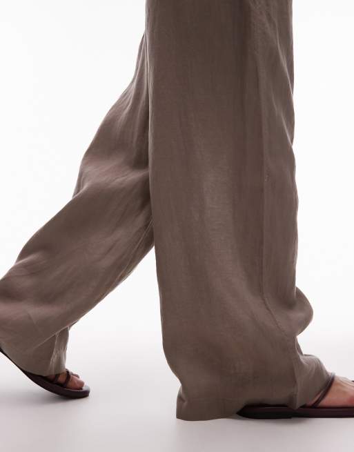 Pantalones marrón moca de corte palazzo con cinturilla sin cierres de lino puro de ARKET, 5 de 5